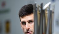 Novak Djokovic of Serbia attends a press conference after beating Borna Coric of Croatia in their men's singles final match at the Shanghai Masters tennis tournament on October 14, 2018. / AFP / Johannes EISELE