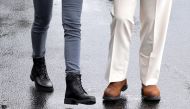 U.S. President Donald Trump and first lady Melania Trump wear boots as they head out together to tour hurricane damage in Florida from the White House in Washington, U.S., October 15, 2018. Reuters/Jonathan Ernst 
