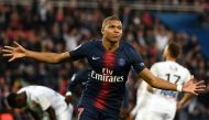 Paris Saint-Germain's French forward Kylian Mbappe celebrates scoring his team's fourth goal during the French L1 football match between Paris Saint-Germain (PSG) and Amiens at the Parc des Princes stadium in Paris on October 20, 2018.. / AFP / FRANCK FIF