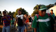 Central American migrants walk along the highway near the border with Guatemala, as they continue their journey trying to reach the U.S., in Tapachula, Mexico October 22, 2018. REUTERS/Ueslei Marcelino