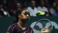 Sloane Stephens of the US reacts as she plays against Japan's Naomi Osaka during their singles match at the WTA Finals tennis tournament in Singapore on October 22, 2018. / AFP / Roslan RAHMAN