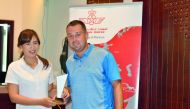 Kenza Gilmour, the Division two winner of the first leg of the Royal Air Moric tournament receiving her prize from Doha Golf Club’s Golf Operations Manager, Jordan Massey.