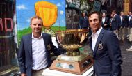 Team Denmark's Soren Kjeldsen (L) and Thorbjorn Olesen (R) pose with the World Cup of Golf trophy in Melbourne on November 20, 2018. AFP / William West 