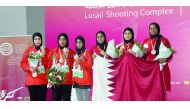 The podium winners at the 14th Arab Championship pose for a picture during the victory ceremony at Losail Shooting Range on Tuesday.