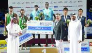 Qatar’s Cherif Younousse and Ahmed Tijan Janko (centre) pose on the podium after winning the AVC Aspire Beach Volleyball Qatar Master 2018 title at Aspire Park, yesterday. Silver medalists Cole Durant and Damien Schumann (left) of Australia, and Japan’s b