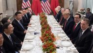 US President Donald Trump (C-R) and China's President Xi Jinping (C-L) along with members of their delegations, hold a dinner meeting at the end of the G20 Leaders' Summit in Buenos Aires, on December 01, 2018. AFP / SAUL LOEB