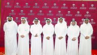 The President of Qatar Football Association Sheikh Hamad bin Khalifa bin Ahmed Al Thani poses for a picture with other Executive Committee members after his re-election in Doha yesterday.