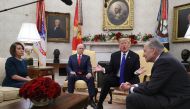 U.S. President Donald Trump (2R) argues about border security with Senate Minority Leader Chuck Schumer (D-NY) (R) and House Minority Leader Nancy Pelosi (D-CA) as Vice President Mike Pence sits nearby in the Oval Office on December 11, 2018 in Washington