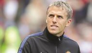 Former England and Manchester United star Phil Neville, coach of the women’s team.