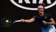 Germany's Alexander Zverev hits a return against Slovenia's Aljaz Bedene during their men's singles match on day two of the Australian Open tennis tournament in Melbourne on January 15, 2019. AFP / Paul Crock 