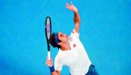 Switzerland's Roger Federer serves against Taylor Fritz of the US during their men's singles match on day five of the Australian Open tennis tournament in Melbourne on January 18, 2019. AFP / David Gray