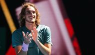 Greece's Stefanos Tsitsipas celebrates his victory against Spain's Roberto Bautista Agut during their men's singles quarter-final match on day nine of the Australian Open tennis tournament in Melbourne on January 22, 2019. AFP / William West 