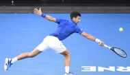 Novak Djokovic of Serbia in action against Kei Nishikori (not seen) of Japan during Australian Open 2019 Men's Singles match in Melbourne, Australia on January 23, 2019. Djokovic advanced to the semifinals after Nishikori retired following his injury. ( R