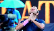 France's Lucas Pouille celebrates his victory against Canada's Milos Raonic during their men's singles quarter-final match on day ten of the Australian Open tennis tournament in Melbourne on January 23, 2019. AFP / David Gray