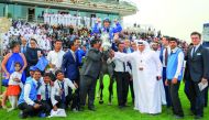 Ebraz’s team celebrates winning the Amir’s Golden Sword at the Qatar Racing and Equestrian Club, yesterday.