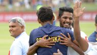 Sri Lanka's teammates celebrate after victory on the third day of the second Test cricket match between South Africa and Sri Lanka at St. George's Park Stadium in Port Elizabeth on February 23, 2019. / AFP / RODGER BOSCH