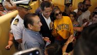 Venezuelan opposition leader Juan Guaido, who many nations have recognized as the country's rightful interim ruler, poses for a picture with supporters while leaving a hotel in Salinas, Ecuador March 3, 2019. Reuters/Daniel Tapia