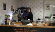 A 20-year-old prisoner makes coffee inside Aylesbury prison, UK, where speciality coffee company Redemption Roasters is training him with industry-level skills. Thomson Reuters Foundation/Lin Taylor