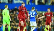 Liverpool's English midfielder Jordan Henderson (C) reacts after drawing the English Premier League football match between Everton and Liverpool at Goodison Park in Liverpool, north west England on March 3, 2019.  AFP / Oli Scarff 