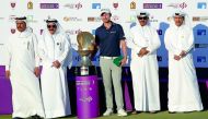 South Africa’s Justin Harding, winner of the Commercial Bank Qatar Masters, poses for a picture with officials of Qatar Golf Association during the presentation ceremony at Doha Golf Club yesterday. 