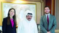 Sheikh Faisal bin Qassim Al Thani, Chairman, Al Faisal Holding, posing for a picture with the representatives of the Oxford Business Group (OBG) after an interview.