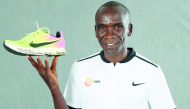 Eliud Kipchoge with his shoe which he wore during his gold medal winning run at the Rio Olympics. Picture courtesy: Giancarlo Colombo/IAAF