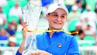  Ashleigh Barty of Australia celebrates with the trophy after her win against Karolina Pliskova of Czech Republic in the final during day thirteen of the Miami Open tennis on March 30, 2019 in Miami Gardens, Florida. Julian Finney/Getty Images/AFP