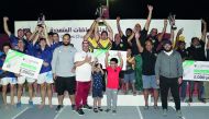 The podium winning teams at the Qatar Olympic Committee’s Winter Camp Multi Games Touch Rugby competition pose for a picture.