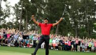 Tiger Woods of the U.S. celebrates on the 18th hole after winning the 2019 Masters, April 14, 2019. REUTERS/Lucy Nicholson