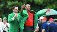 Tiger Woods (R) of the United States is awarded the Green Jacket by Masters champion Patrick Reed (L) during the Green Jacket Ceremony after winning the Masters at Augusta National Golf Club on April 14, 2019 in Augusta, Georgia. Mike Ehrmann/Getty Images