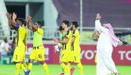  The players of Qatar SC celebrate their win.