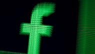 FILE PHOTO: A 3D-printed Facebook logo are seen in front of displayed binary digits in this illustration taken, March 18, 2018. REUTERS/Dado Ruvic/Illustration