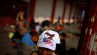 Central American migrants gather in an improvised shelter during a break in their journey towards the United States, in Escuintla, Mexico April 19, 2019. REUTERS/Jose Cabezas