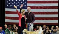 
In this file photo taken on January 12, 2019 Senator Elizabeth Warren (D-MA), husband Bruce Mann and their dog Bailey take the stage before Warren addresses an “Organizing Event” as part of her exploratory presidential committee at Manchester Community 
