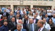 Employees of the Lebanese central bank gather during a strike over state budget proposals that would cut their benefits, in front of the central bank in Beirut, Lebanon May 6, 2019. REUTERS/Mohamed Azakir