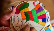 Mexican artisan Glafira Candelaria Jose, of the Otomi ethnic group, embroiders one of her designs at her workshop in San Nicolas village, in Tenango de Doria, Hidalgo state, Mexico, on June 18, 2019. AFP / Pedro PARDO