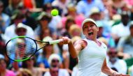 Romania's Simona Halep returns against Ukraine's Elina Svitolina during their women's singles semi-final match on day ten of the 2019 Wimbledon Championships at The All England Lawn Tennis Club in Wimbledon, southwest London, on July 11, 2019. AFP / Danie