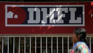 FILE Photo: A woman walks past a signboard of Dewan Housing Finance Corporation Ltd. (DHFL) outside its office on the outskirts of Mumbai January 31, 2019. (REUTERS/Francis Mascarenhas/Files)