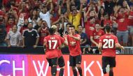 Manchester United's Mason Greenwood (2nd R) is congratulated by teammates after scoring during the International Champions Cup football match between Manchester United and Inter Milan in Singapore on July 20, 2019. (AFP / Roslan RAHMAN)