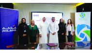 Saleh Abdullah Al Haroon (third left), Executive Vice-President of Support Services at Milaha; and Abdallah Al Suwaidi, Chairman of Elite Paper Recycling (third right), and other officials during the signing ceremony. 