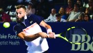 Benoit Paire of France returns a shot from Steve Johnson during their semifinals match on day seven of the Winston-Salem Open at Wake Forest University on August 23, 2019 in Winston Salem, North Carolina. Jared C. Tilton/Getty Images/AFP