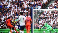 Newcastle United's Brazilian striker Joelinton (L) shoots past Tottenham Hotspur's French goalkeeper Hugo Lloris (R) to score the opening goal of the English Premier League football match between Tottenham Hotspur and Newcastle United at Tottenham Hotspur