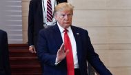 US President Donald Trump arrives to attend a lunch on 