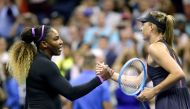 Maria Sharapova (R) of Russia shake hands after losing against Serena Williams of the United Sates during their Round 1 women's Singles match at the 2019 US Open at the USTA Billie Jean King National Tennis Center in New York on August 26, 2019. / AFP / K