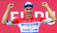 Team Deceuninck rider Netherlands' Fabio Jakobsen celebrates on the podium after winning the fourth stage of the 2019 La Vuelta cycling tour of Spain, a 175,5 km route from Cullera to El Puig, on August 27, 2019 in El Puig. AFP / Jose Jordan 