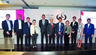 Singapore’s Ambassador to Qatar, Jai S Sohan (fifth left); Commercial Bank Group CEO Joseph Abraham (centre); and other officials posing for a group picture at the SBCQ’s third networking event held at Commercial Bank Plaza. Pic: Abdul Basit/THE PENINSULA