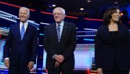 Joe Biden, Bernie Sanders and Kamala Harris pose before the start of the second US 2020 presidential election Democratic candidates debate in Miami, June 27, 2019. Reuters / Carlo Allegri