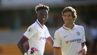 Chelsea's Tammy Abraham celebrates with teammate Marcos Alonso whilst holding the matchball after scoring a hat-trick. Reuters/Carl Recine 