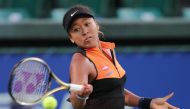 Japan's Naomi Osaka hits a return against Bulgaria's Viktoriya Tomova in women's singles round of 16 at the Pan Pacific Open tennis tournament in Osaka on September 18, 2019. Japan OUT / AFP / JIJI PRESS / Jiji Press