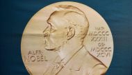 A portrait of Alfred Nobel can be seen on a banner on display at the Nobel Forum in Stockholm , Sweden on October 01, 2018. AFP / Jonathan Nackstrand
 